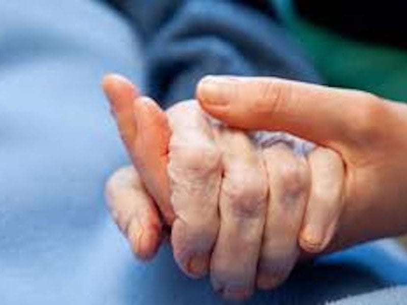 holding an elder's hand