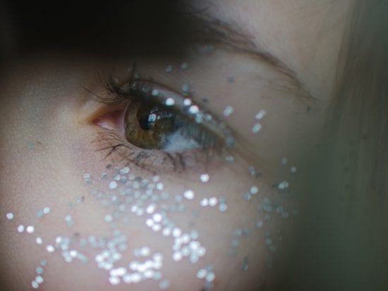 glitter around a woman's eye
