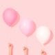 three pretty pink balloons in a row