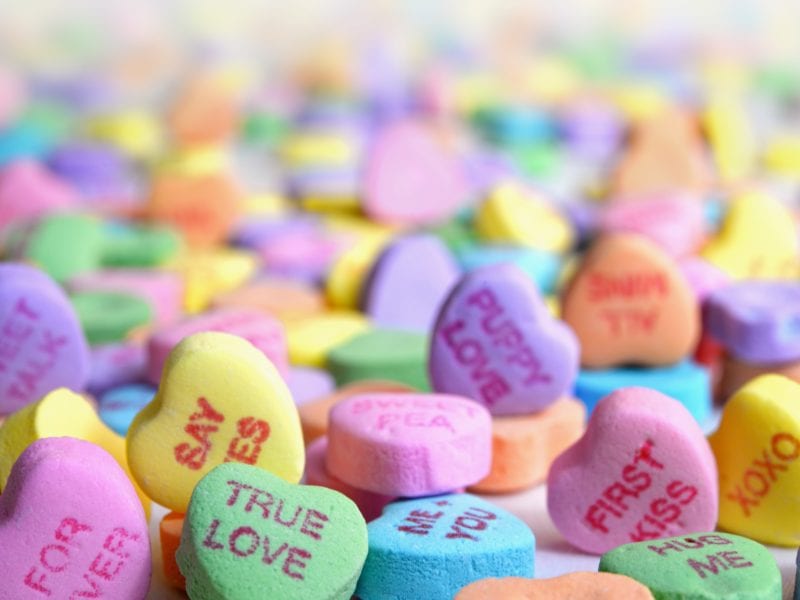 a collection of candy hearts with sweet love messages